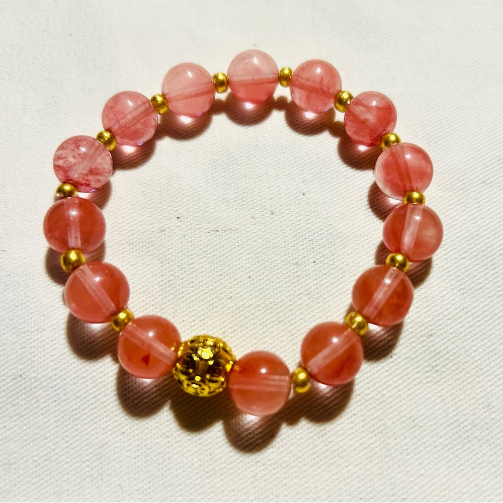 strawberry quartz crystal bracelet, for
 love, joy, and emotional healing.